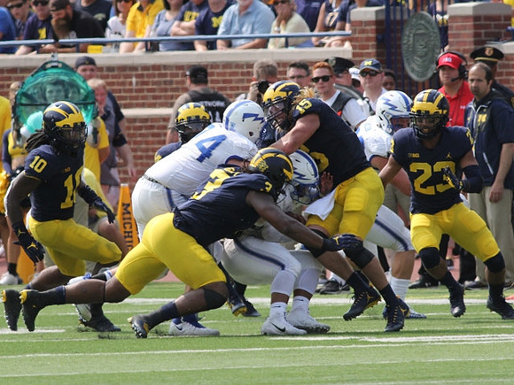 Devin Bush (10), Rashan Gary (3), Chase Winovich (15), and Tyree Kinnel (23)