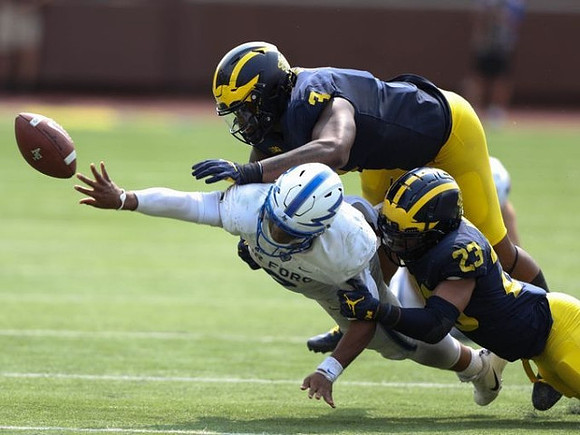 Rashan Gary (3) and Tyree Kinnel (23)