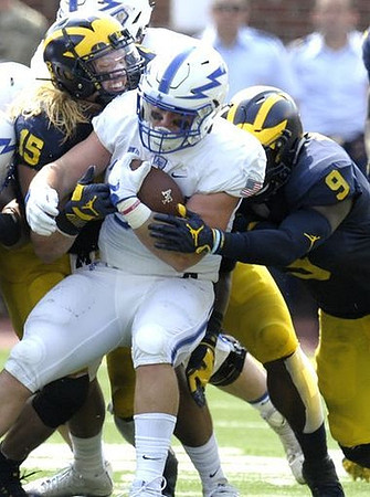Chase Winovich (15) and Mike McCray (9)