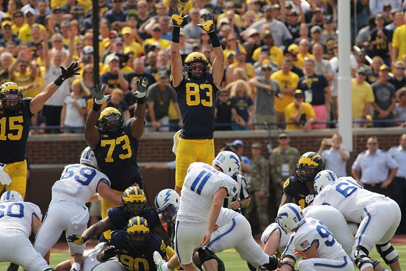 Chase Winovich (15), Bryan Mone (90), Maurice Hurst (73), Zach Gentry (83), and Devin Bush (10)