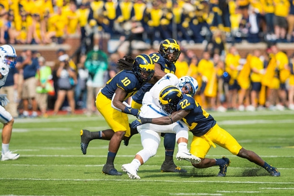 Devin Bush (10), Maurice Hurst (73), and David Long (22)