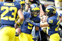Tyree Kinnel (23), Mike McCray (9), and Brandon Watson (28)
