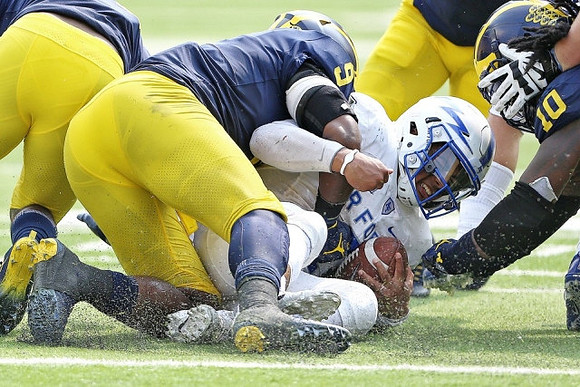 Mike McCray (9) and Devin Bush (10)