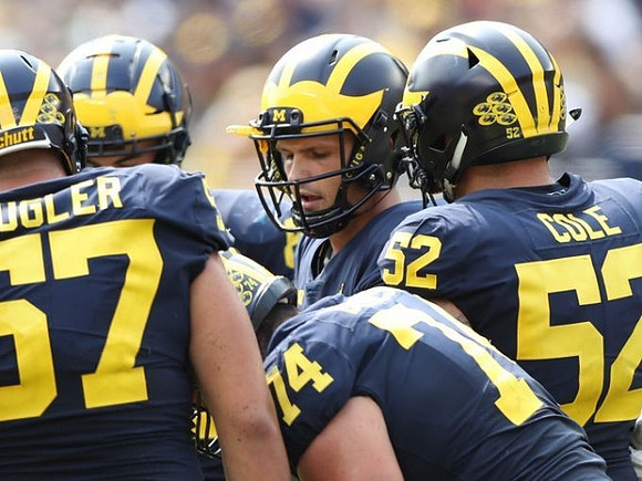 Patrick Kugler (57), Ben Bredeson (74), Wilton Speight (3), and Mason Cole (52)