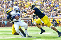 Devin Bush (10) and Chase Winovich (15)