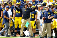 Jim Harbaugh, Dan Jokisch (61), and Joe Beneducci (30)