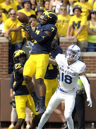 Karan Higdon (22) and Tarik Black (7)