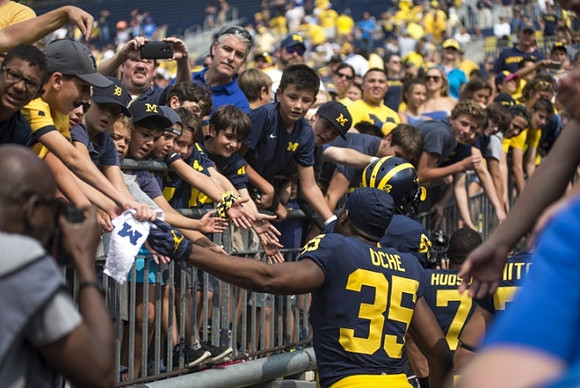 Josh Uche (35) and Khaleke Hudson (7)