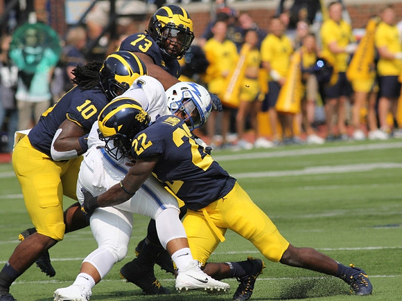 Devin Bush (10), Maurice Hurst (73), and David Long (22)