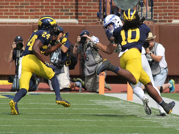 Lavert Hill (24) and Devin Bush (10)