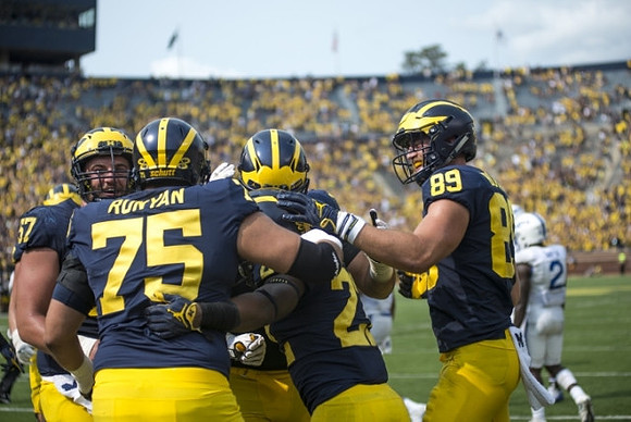 Patrick Kugler (57), Jon Runyan Jr. (75), Karan Higdon (22), and Ian Bunting (89)
