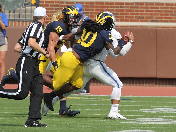 Chase Winovich (15) and Devin Bush (10)