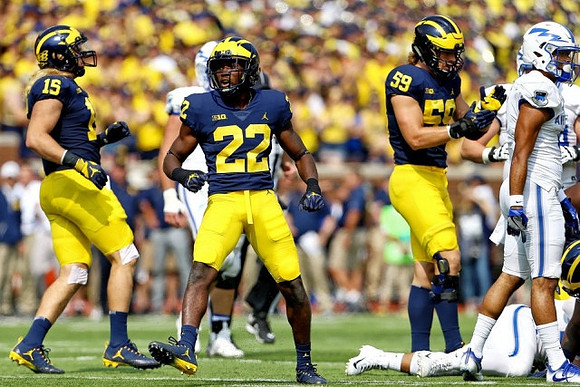 Chase Winovich (15), David Long (22), and Noah Furbush (59)