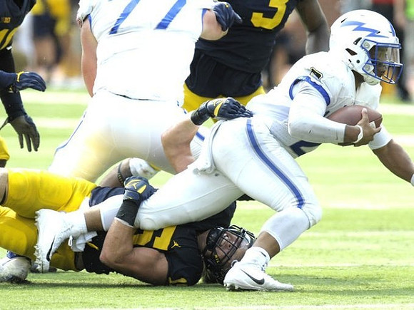 Chase Winovich (15) and Rashan Gary (3)