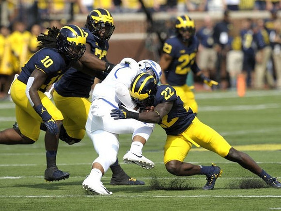Devin Bush (10), Maurice Hurst (73), David Long (22), and Tyree Kinnel (23)