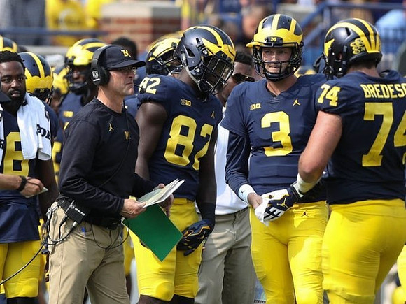 Jim Harbaugh, Nick Eubanks (82), Wilton Speight (3), and Ben Bredeson (74)