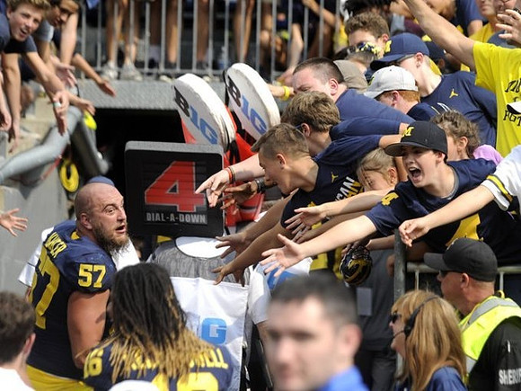 Patrick Kugler (57) and Jaylen Kelly-Powell (16)