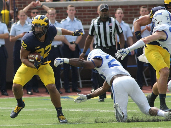 Karan Higdon (22) and Zach Gentry (83)
