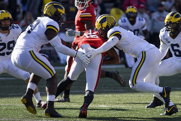 Jordan Glasgow (29), Kwity Paye (19), Khaleke Hudson (7), Brad Hawkins (20), and Josh Uche (6)