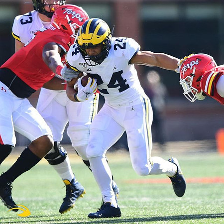 Jalen Mayfield (73) and Zach Charbonnet (24)
