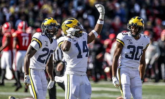 Brad Hawkins (20), Josh Metellus (14), and Daxton Hill (30)