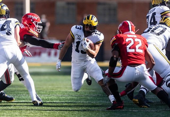 Sean McKeon (84), Tru Wilson (13), Ben Bredeson (74), and Michael Onwenu (50)