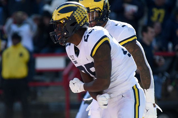 Michael Barrett (23) and Khaleke Hudson (7)
