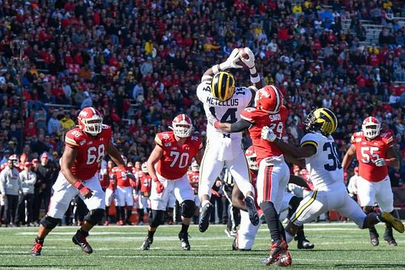 Josh Metellus (14) and Daxton Hill (30)