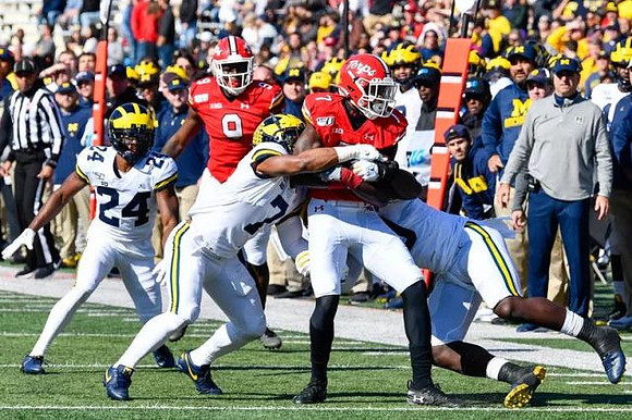 Lavert Hill (24) and Khaleke Hudson (7)