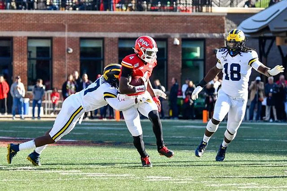 Khaleke Hudson (7) and Luiji Vilain (18)