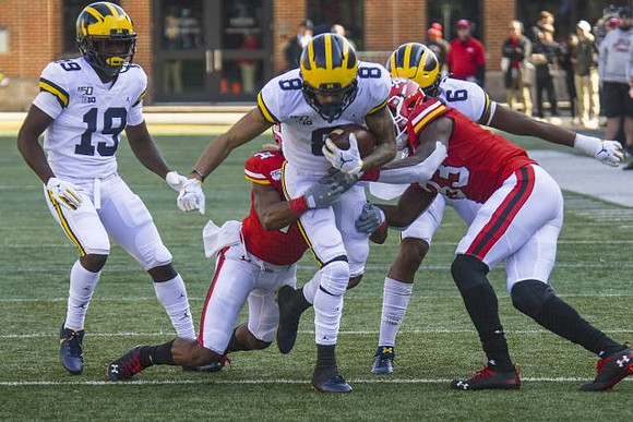 Mike Sainristil (19), Ronnie Bell (8), and Donovan Peoples-Jones (9)