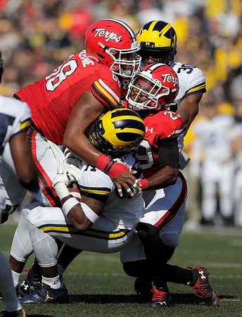 Josh Metellus (14) and Daxton Hill (30)