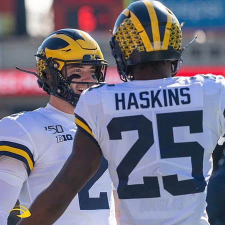 Shea Patterson (2) and Hassan Haskins (25)