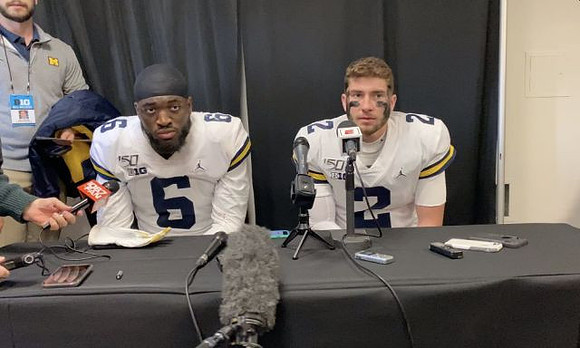 Josh Uche (6) and Shea Patterson (2)