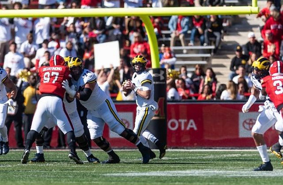 Shea Patterson (2) and Ben Bredeson (74)