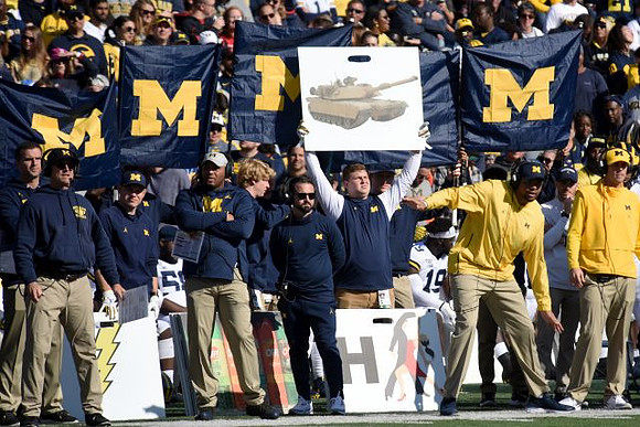 Jim Harbaugh, Josh Gattis, and Grant Newsome