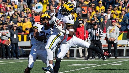 Daxton Hill (30) and Josh Metellus (14)