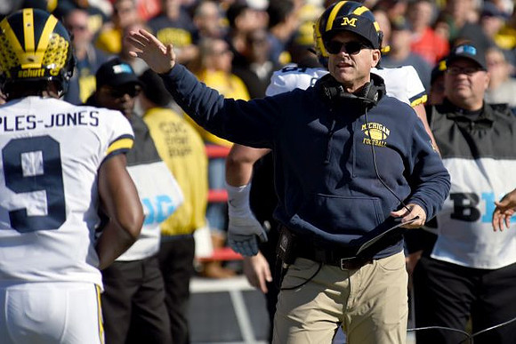 Donovan Peoples-Jones (9) and Jim Harbaugh