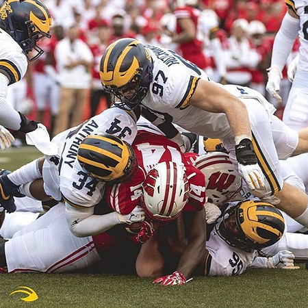 Jordan Anthony (34), Aidan Hutchinson (97), and Donovan Jeter (95)