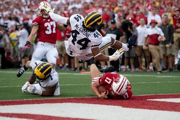 Khaleke Hudson (7) and Cameron McGrone (44)