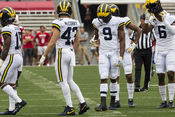 Giles Jackson (15), Jake McCurry (43), Donovan Peoples-Jones (9), and Cornelius Johnson (6)