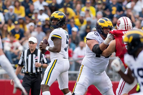 Joe Milton (5) and Jon Runyan Jr. (75)