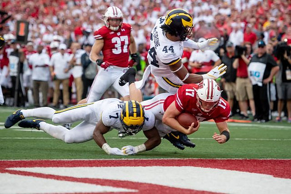 Khaleke Hudson (7) and Cameron McGrone (44)
