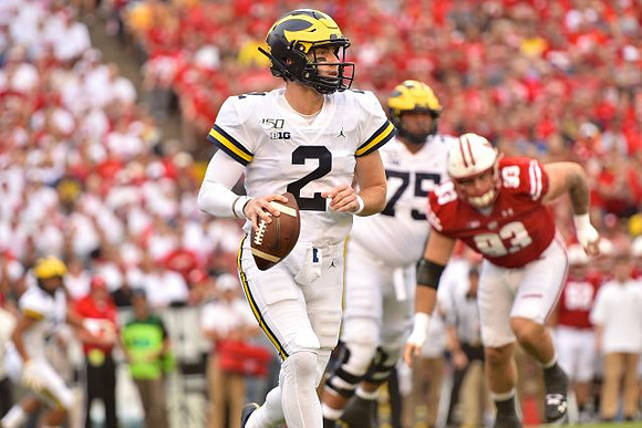 Shea Patterson (2) and Jon Runyan Jr. (75)