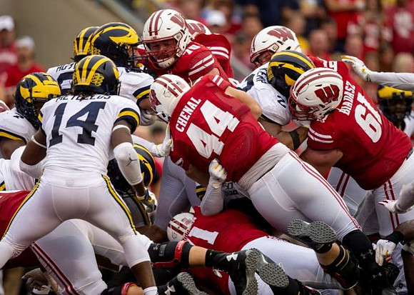 Josh Metellus (14), Khaleke Hudson (7), and Carlo Kemp (2)