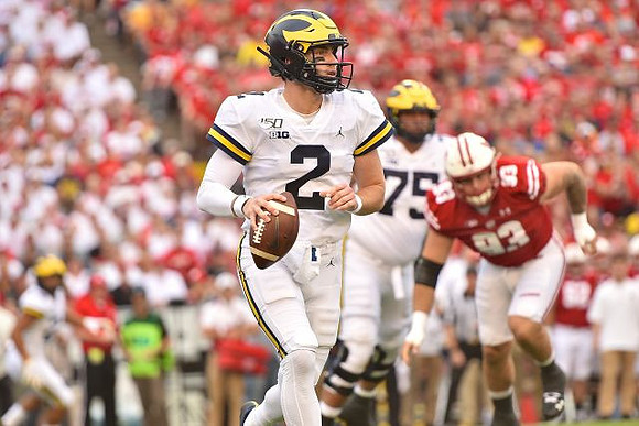 Shea Patterson (2) and Jon Runyan Jr. (75)