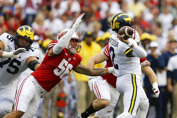 Jon Runyan Jr. (75) and Shea Patterson (2)