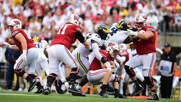 J'Marick Woods (26), Kwity Paye (19), and Michael Danna (4)