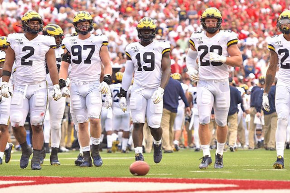 Carlo Kemp (2), Aidan Hutchinson (97), Kwity Paye (19), Jordan Glasgow (29), and J'Marick Woods (26)