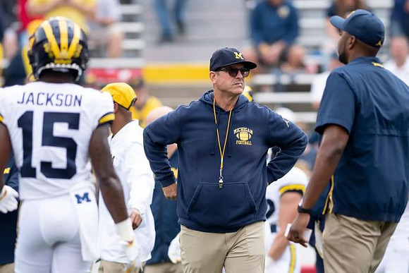 Giles Jackson (15) and Jim Harbaugh
